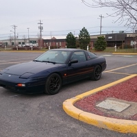 Blue 1992 Nissan 200SX on Black Rota Torque