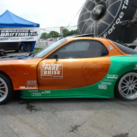Orange 1994 Mazda RX-7 on Silver/Chrome Enkei RPF1 type RC