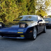 Blue 1989 Mazda RX-7 on White Enkei RPF1