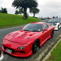 Red 1992 Mazda RX-7 on Brown Rota Grid-V