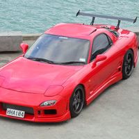Red 1992 Mazda RX-7 on Brown Rota Grid-V