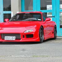 Red 1992 Mazda RX-7 on Brown Rota Grid-V