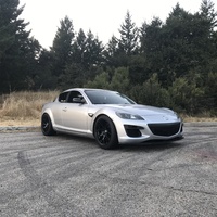 Silver/Chrome 2009 Mazda RX-8 on Black Enkei Raijin