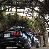 Black 1990 Mazda RX-7 on Silver/Chrome Enkei Kojin