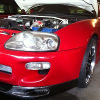 Red 1995 Toyota Supra on Black Cruize 190