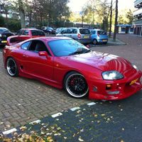 Red 1995 Toyota Supra on Black Cruize 190