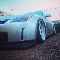 Silver/Chrome 2003 Nissan 350Z on White Cosmis XT-206R