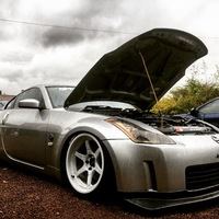 Silver/Chrome 2003 Nissan 350Z on White Cosmis XT-206R