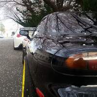 Black 1993 Mazda RX-7 on Yellow Enkei PF01