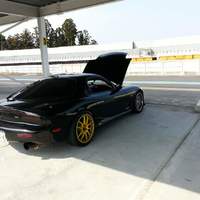 Black 1993 Mazda RX-7 on Yellow Enkei PF01