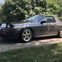 Gray 1987 Mazda RX-7 on Gold Rays Jdm