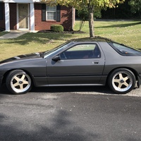Gray 1987 Mazda RX-7 on Gold Rays Jdm