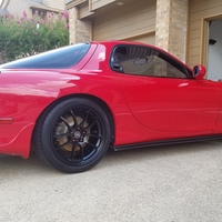 Red 1993 Mazda RX-7 on Black Enkei PF01