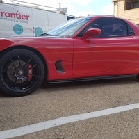 Red 1993 Mazda RX-7 on Black Enkei PF01