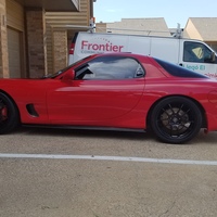 Red 1993 Mazda RX-7 on Black Enkei PF01