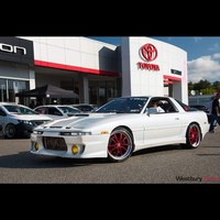 White 1987 Toyota Supra on Red Work Bergaslio