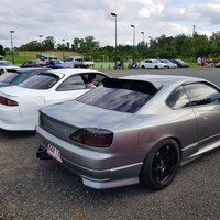 Gray 1999 Nissan Silvia on Black Rota Grid Drift