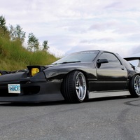Black 1988 Mazda RX-7 on Silver/Chrome Heritage Matsu