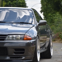 Gray 1991 Nissan Skyline GTR on Silver/Chrome Panasport G7-C5C