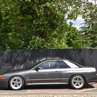 Gray 1991 Nissan Skyline GTR on Silver/Chrome Panasport G7-C5C